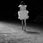 Fashion model walking a runway, representing Gabriella Brooks's modeling career