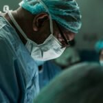 Orthopedic surgeon in medical scrubs representing Dr. Daniel Christopher Allison's career in orthopedic oncology