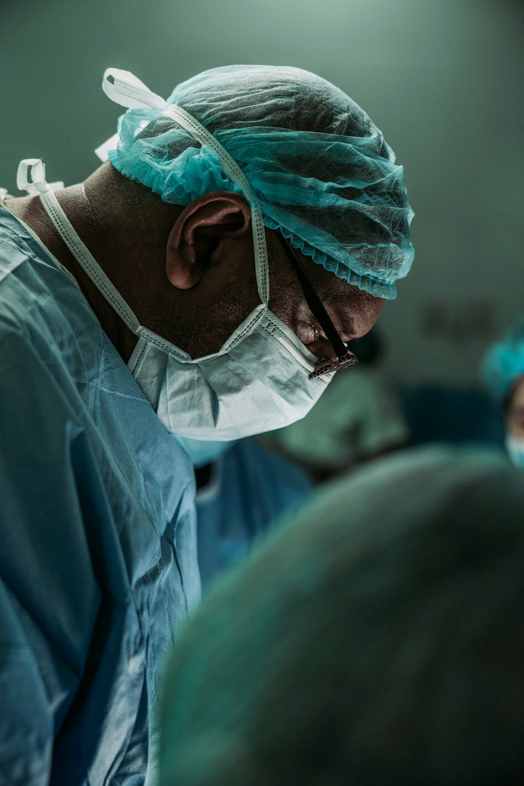 Orthopedic surgeon in medical scrubs representing Dr. Daniel Christopher Allison's career in orthopedic oncology